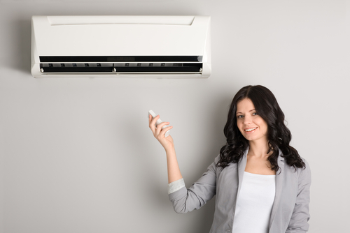 ductless ac unit and woman