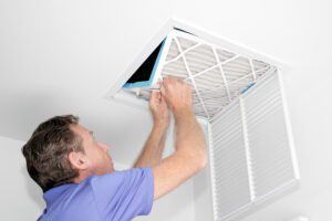 technician cleaning air ducts